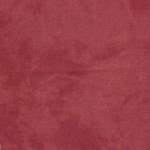 May include: Close-up of a piece of red fabric with a textured weave. The fabric has a slightly faded appearance, with variations in the red hue. The edges of the fabric are not perfectly straight, suggesting a handmade or natural textile.
