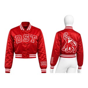 May include: A red satin bomber jacket featuring white striped ribbed trim on the collar, cuffs, and hem. The front displays the white text DST, while the back showcases a large white elephant graphic with the Greek letters Delta Sigma Theta.