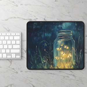 May include: Mousepad featuring a jar filled with glowing fireflies. The jar is set against a backdrop of tall grass and a dark, blue-toned forest. The image has a whimsical, magical feel.
