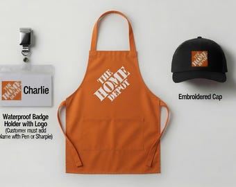 May include: An orange apron with The Home Depot logo in white, a black baseball cap with an embroidered orange and white logo, and a clear plastic badge holder with a metal clip featuring The Home Depot logo and the printed name Charlie.