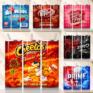 May include: A collection of insulated tumblers with various designs. The tumblers feature graphics for Air Heads Cherry, Dr. Pepper, Sweet Cherry Pop, Cheetos Flamin' Hot, Coca-Cola Zero, and Prime Ice Pop. Each tumbler has a silver straw.