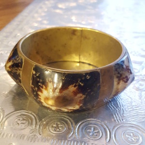 Antique cowrie shell and brass bangle
