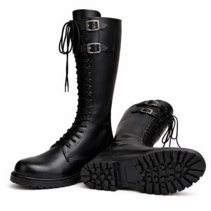 May include: Two black leather knee-high boots. One boot is upright, the other is lying on its side. Both boots have laces, buckles, and thick soles. The boots are made of smooth, shiny leather.