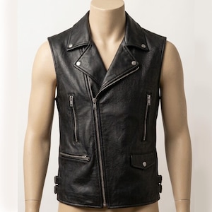 May include: A black leather vest featuring a wide notched collar with silver-tone metal snaps, an asymmetrical front zipper closure, two vertical zippered chest pockets, one horizontal zippered pocket, one small flap pocket, and side buckle straps.
