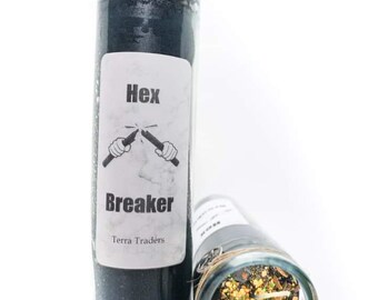 May include: Black glass candle with a label that reads "Hex Breaker" and "Terra Traders". The candle has a pentagram charm attached to the top. The candle is next to a clear glass jar with a black candle inside and a variety of herbs and crystals.