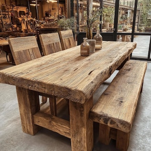 May include: A dining set featuring a large rectangular table with a thick, weathered wood top and sturdy block legs, accompanied by three matching wooden chairs and a long wooden bench, with three glass bottles placed on the table surface.