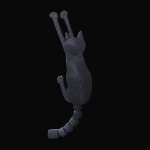 May include: A dark gray cat-shaped wall hook with its front paws raised. The cat's tail is segmented, and the hook is designed to be mounted on a wall. The cat is in a climbing pose, with a textured surface.