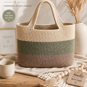 May include: A handmade crochet tote bag with a beige, olive green, and brown color block design. The bag has sturdy handles and includes a PDF pattern. The text "CROCHET TOTE BAG" is at the top, with "HANDMADE | STYLISH | DURABLE" below it.
