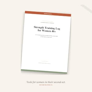 May include: A white workbook titled "Strength Training Log for Women 40+" with an orange and green border. The cover includes the text "A 12-week progressive strength tracking system built for the body you have now."