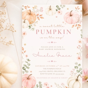 May include: A rectangular baby shower invitation card featuring watercolor illustrations of pumpkins and flowers in shades of orange, pink, and white. The text reads: a sweet little PUMPKIN is on the way! PLEASE JOIN US FOR A BABY SHOWER HONORING Amelia Grace, SATURDAY, OCTOBER 13TH AT 2:00 PM, THE PUMPKIN PATCH, 1234 FALL GROVE, ORLANDO, FL, RSVP TO JANE AT 555-555-5555, REGISTERED AT AMAZON & TARGET.