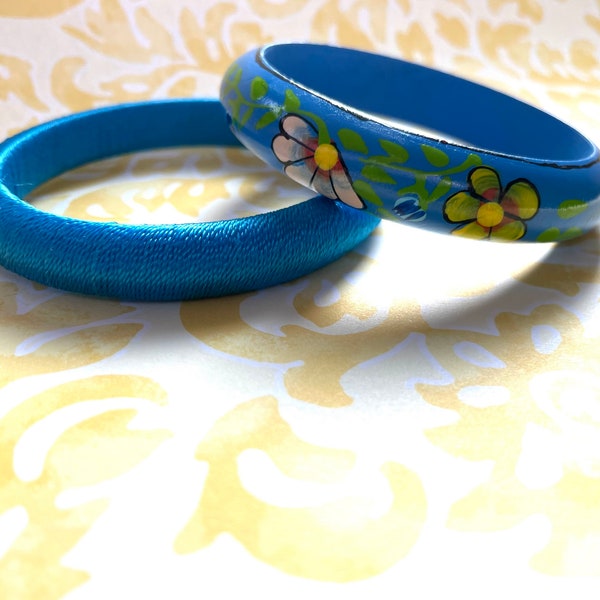 Set of bangles in bright blue from 1970s hand painted flowers and shiny thread