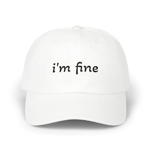 A "i'm fine" and "i lied." white cap