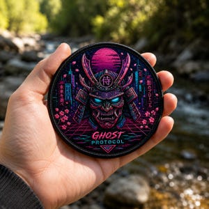 May include: A circular embroidered patch featuring a samurai helmet with glowing blue eyes, set against a dark neon cityscape with pink cherry blossoms, a magenta sun, and the text GHOST PROTOCOL in a retro-futuristic style with Japanese characters.