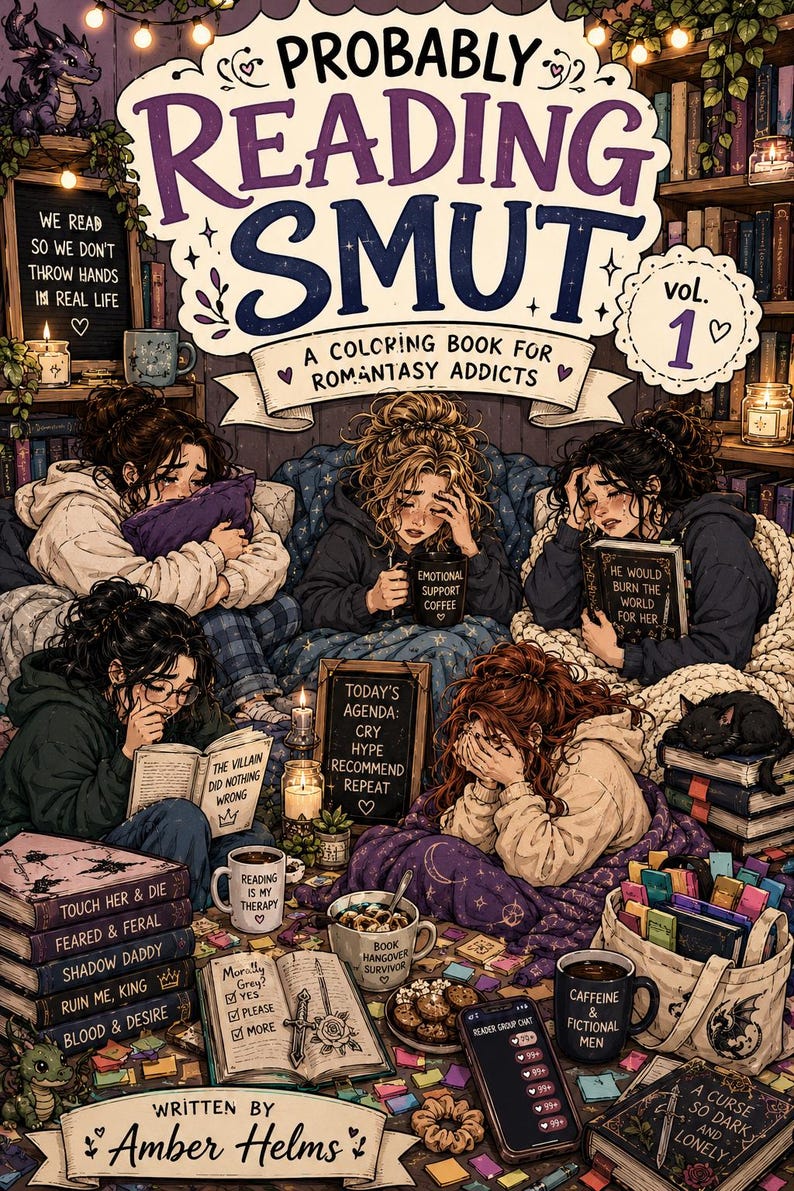 May include: Illustration of a coloring book titled "Probably Reading Smut, Vol. 1" with several people reading and surrounded by books, mugs, and a black cat. The book is subtitled "A Coloring Book for Romantasy Addicts."