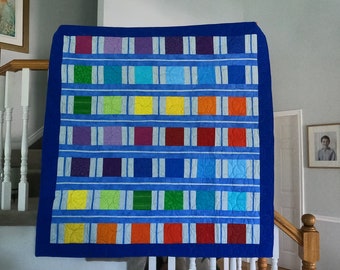 53" x 54" Blue Quilt called Hopscotch. Bright Colors with Light and Dark Blue. Rainbow Colors of Blocks. Large Trow Size Quilt.