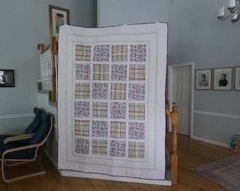 64" x 90" Modern Pastel Quilt. Made with fun modern fabric that looks like water color. White and yellow, pink and blue. Large guilt.