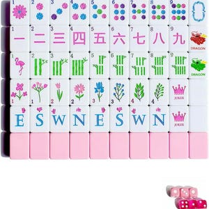 May include: A set of white mahjong tiles with pink backs, featuring colorful illustrations of flowers, bamboo, flamingos, dragons, and the letters E, S, W, N. The tiles display numbers 1 through 9 in Chinese characters and numerals, plus pink joker tiles and translucent pink dice.