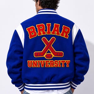 May include: A blue varsity jacket with white sleeves and trim. The back features the words "BRIAR UNIVERSITY" in red and gold lettering, along with crossed hockey sticks and a puck.