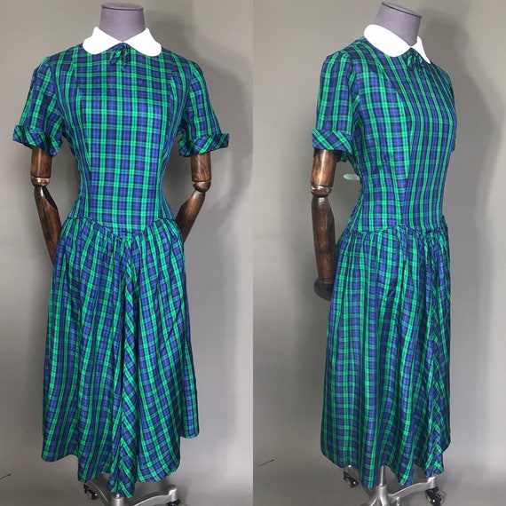 Plaid 1940s day dress on blue and green