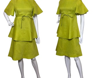 May include: A lime green dress with a tiered skirt and short, flared sleeves. The dress has a square neckline and a tie at the waist.