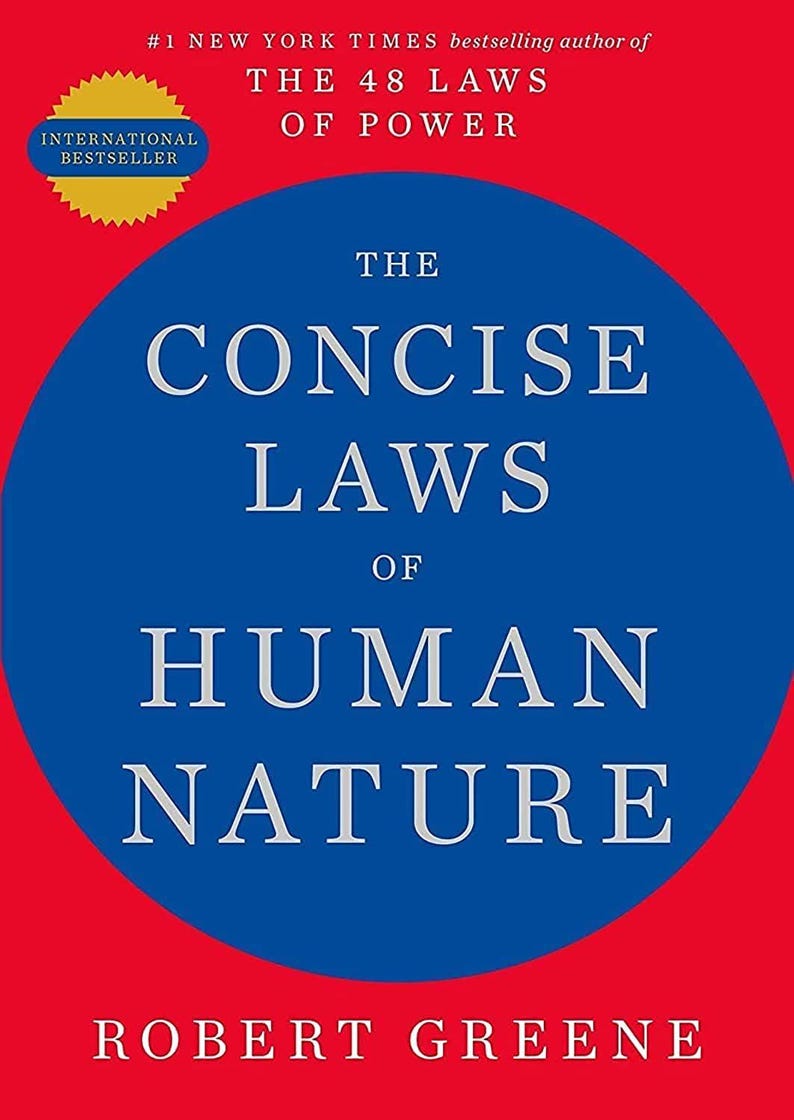 May include: A book cover with a bright red background and a large blue circle in the center. The text reads: #1 NEW YORK TIMES bestselling author of THE 48 LAWS OF POWER, THE CONCISE LAWS OF HUMAN NATURE, and ROBERT GREENE at the bottom.