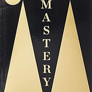 May include: The book cover for The Concise Mastery by Robert Greene features a black background with two large, gold-colored triangles pointing upward. The title Mastery is printed in white capital letters vertically between the gold shapes.
