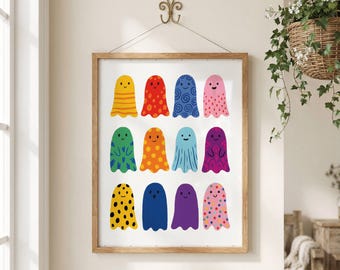 May include: A framed wall art print featuring twelve colorful ghost illustrations arranged in a grid. Each ghost has a unique pattern, including stripes, polka dots, swirls, and solid colors, with simple facial expressions on a white background.