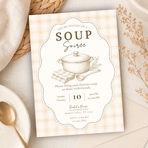 May include: A rectangular invitation card with a light beige plaid background featuring a central scalloped frame. The text reads: YOU'RE INVITED TO A SOUP Soirée, Please bring your favorite soup to share with friends, Sunday October 10, 5:00 PM to 7:00 PM, Rachel's House 123 Orchard Lane Hudson Valley, NY 12334, RSVP to Rachel 123.456.7890. A sketch of a lidded pot, a folded cloth, and a ladle is centered.