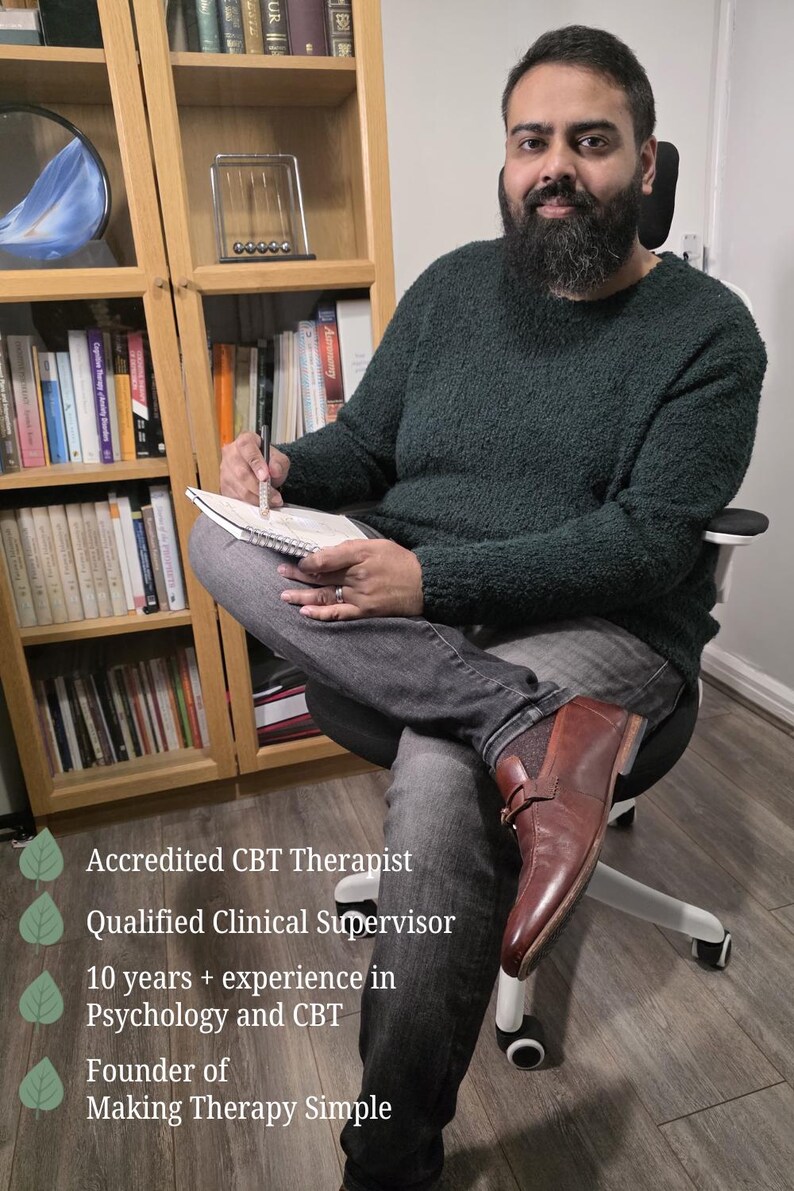 May include: A person with a beard wearing a dark green textured sweater and gray jeans, sitting in a chair while holding a pen and notebook. Text reads: Accredited CBT Therapist, Qualified Clinical Supervisor, 10 years + experience in Psychology and CBT, Founder of Making Therapy Simple.