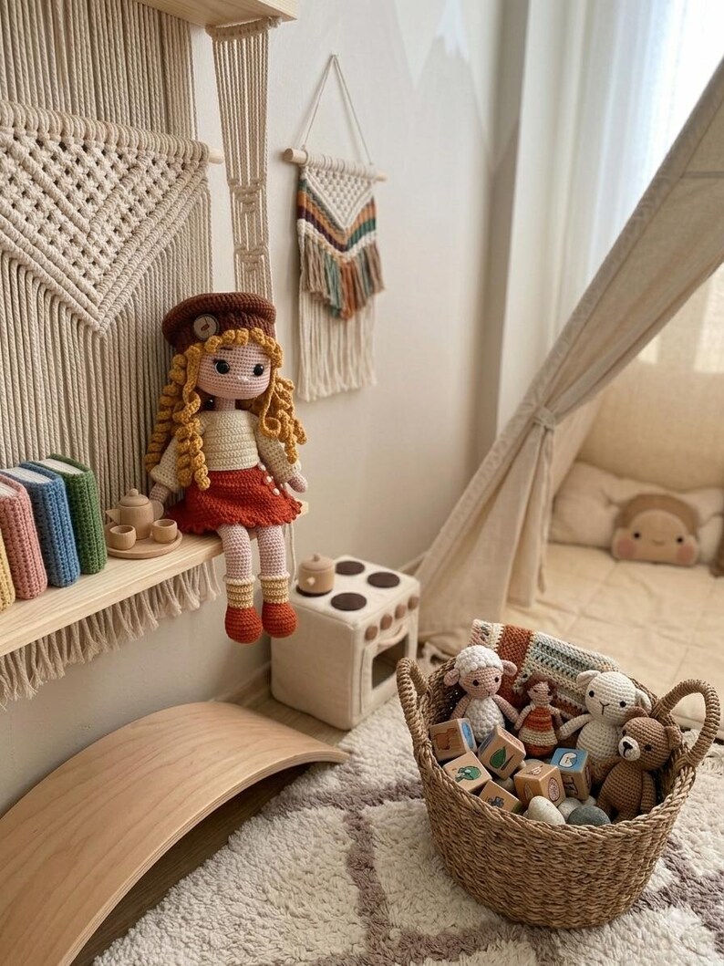 May include: A cozy children's room with a handmade crochet doll wearing a brown hat and red skirt. A woven basket holds stuffed animals and wooden blocks. A wooden balance board and a small play kitchen add to the playful atmosphere.