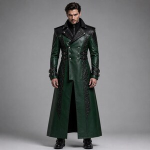 May include: A long, dark green coat featuring black leather-like panels on the shoulders and chest, intricate black embossed scrollwork patterns, silver-toned buttons, and adjustable buckle straps at the waist and cuffs, worn over a black shirt.