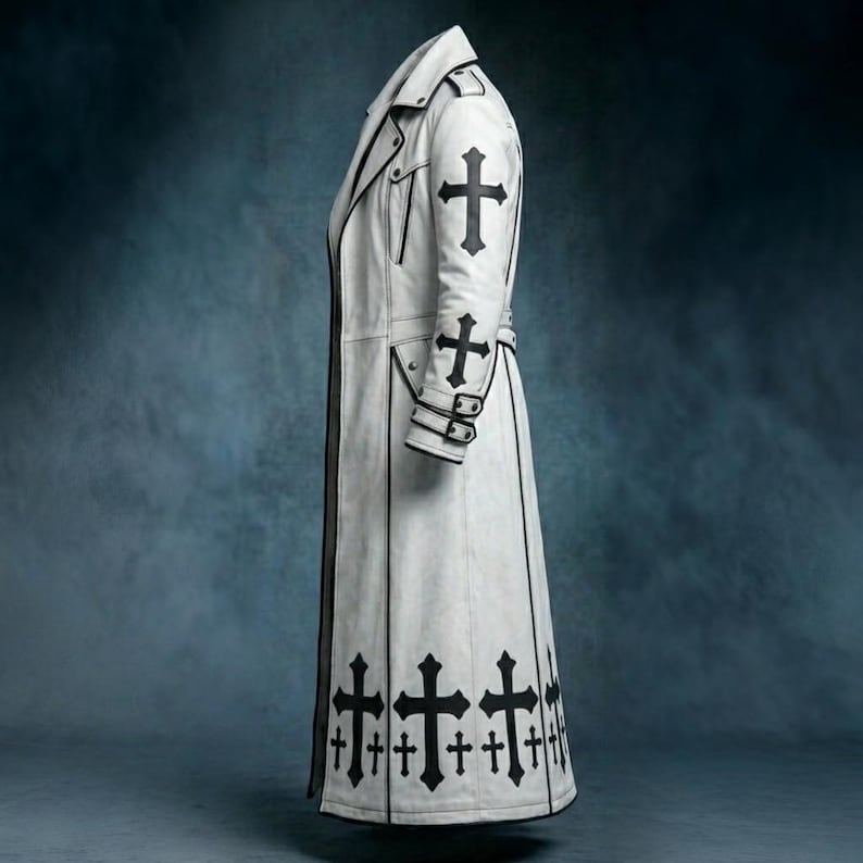 White gothic long trench coat featuring black cross embellishments, tailored silhouette, full-length design, alternative fashion outerwear, front and back view displayed on dark background.