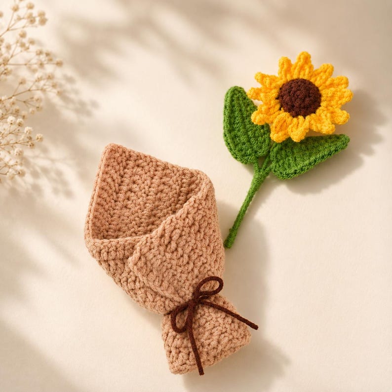 Finished sunflower bouquet held in hand showing full arrangement of crocheted flowers and leaves