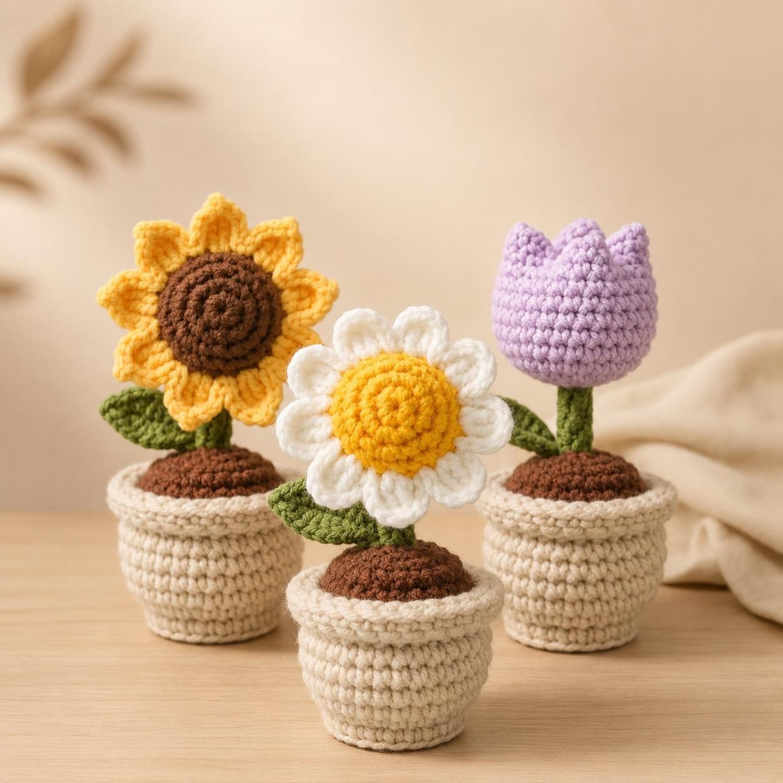 Close-up of a single mini crochet flower pot featuring detailed amigurumi flower petals and a textured stitched pot base