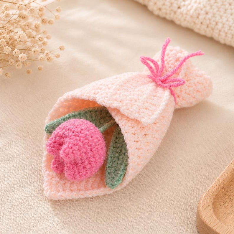Close-up of a single crocheted tulip showing cup-shaped petal construction and stitch detail