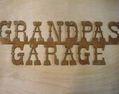 Metal Grandpas Garage Sign