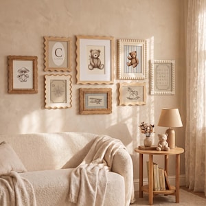 May include: A gallery wall arrangement featuring eight wooden frames with scalloped or beaded edges, containing illustrations of mushrooms, a letter C, a teddy bear, a compass, an airplane, a rocking horse, and an alphabet chart.