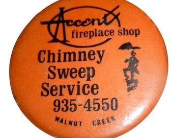 Negozio di camini vintage con accenti decorativi, servizio di spazzacamino, bottone a spilla arancione, noce