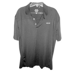 May include: Black short-sleeve polo shirt with a collared neckline and three-button placket. The shirt has a small white logo on the chest and is hanging on a clear hanger. The material appears to be a lightweight, breathable fabric.