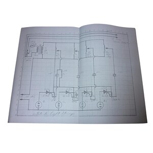 May include: A hand-drawn electronic circuit diagram on white grid paper. The schematic features various symbols for resistors, capacitors, diodes, and transformers, with handwritten labels including "To 110 VAC" and "Outputs to Light Strings."
