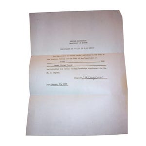 May include: A white paper certificate from Indiana University Department of German titled Certificate of Ability to Read German. It states Janet Eloise Tupper has satisfied the German reading knowledge requirement for the Ph.D. degree, dated January 23, 1962.