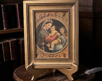 Impresión vintage adornada con marco dorado "Madonna della Seggiola" en placa de madera