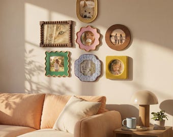 May include: A collection of framed photos in various shapes and colors, including oval, round, and square. The frames are made of wood and have different decorative edges. The photos feature a dog, a cat, and people.