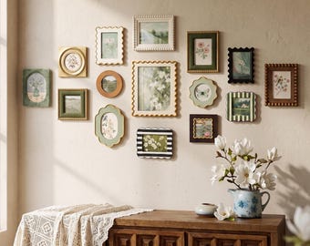May include: A gallery wall arrangement featuring fifteen assorted picture frames in various shapes, colors, and textures, including scalloped, beaded, and smooth edges, displaying botanical and landscape art prints on a plain wall.