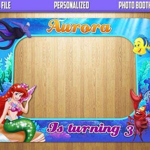 May include: A rectangular photo booth frame featuring an underwater theme with blue water, coral, and seaweed. The frame displays the text "DIGITAL FILE", "PERSONALIZED", "PHOTO BOOTH FRAME", "Aurora", and "Is turning 3". Characters include a mermaid, a crab, a yellow fish, and a purple sea witch.