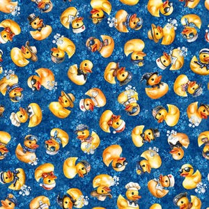May include: A repeating pattern of yellow rubber ducks on a dark blue background with white bubbles. The ducks are depicted wearing various accessories including hats, scarves, sunglasses, and headgear, scattered across the textured blue surface.