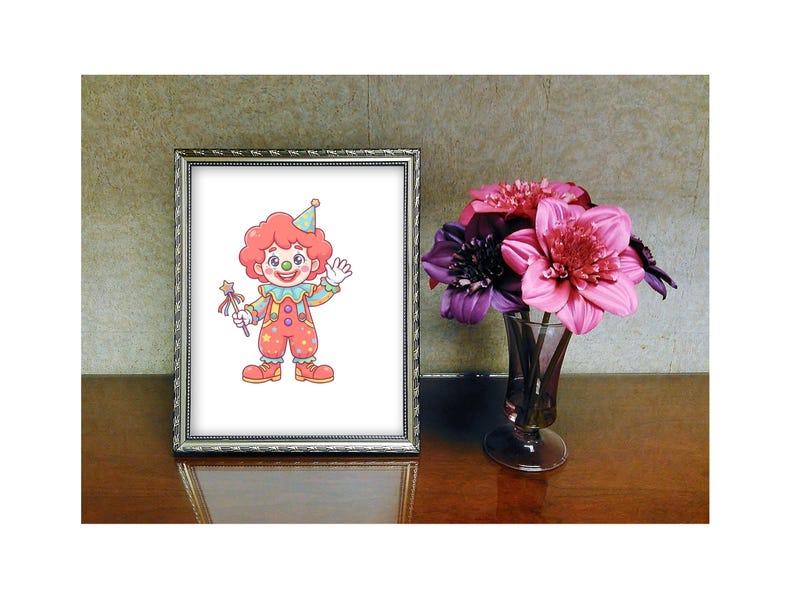 May include: A framed picture of a cartoon clown with red hair, a party hat, and colourful clothing. The clown is holding a wand and waving. A vase of pink and purple flowers sits to the right of the frame on a wooden surface.