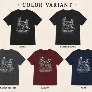 May include: Five short-sleeve t-shirts in black, heather black, dark grey heather, maroon, and navy. Each shirt features a white graphic print of a skeleton and a person with the text MEMENTO MORI, REMEMBER YOU MUST DIE, HOLBEIN - DANSE MACABRE.