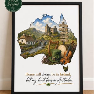 May include: Framed art print with a watercolour illustration of Ireland and Australia. The artwork includes a castle, a harp, a violin, and a leprechaun hat. Text reads "Home will always be in Ireland, but my heart lives in Australia."