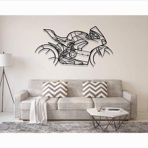 May include: A black metal wall art piece depicting the silhouette of a sport motorcycle. The design features intricate geometric lines and cutouts that define the frame, wheels, engine, and fairings of the bike in a stylized, open-frame format.